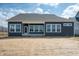 Exterior back of house with multiple windows under a covered porch and large yard at 798 Leila Mae Ln, Westfield, IN 46074