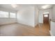 Bright entryway with wood floors, a wooden door, and lots of natural light from the large windows at 798 Leila Mae Ln, Westfield, IN 46074