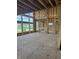 A bright living room featuring large window framing for natural light, with exposed beams and wood framework at 8030 Totton Ct, Zionsville, IN 46077