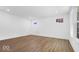 Bright bedroom with wood floors, recessed lighting, and large windows offering natural light at 9344 Anthem Ave, Plainfield, IN 46168