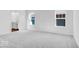 Large bedroom with neutral carpet, bright windows and ensuite access at 9344 Anthem Ave, Plainfield, IN 46168