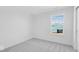 Well-lit bedroom with neutral carpet, bright window and exterior view at 9344 Anthem Ave, Plainfield, IN 46168