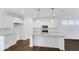 Modern kitchen featuring white cabinets, granite countertops, a center island, and stainless steel appliances at 9344 Anthem Ave, Plainfield, IN 46168