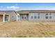 Large back yard with a covered patio and modern siding at 235 Hunters Ridge Dr, Danville, IN 46122