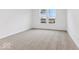 Clean bedroom with neutral carpet and large windows offering backyard views at 235 Hunters Ridge Dr, Danville, IN 46122