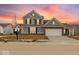 Inviting two-story home with colorful sunset at 235 Hunters Ridge Dr, Danville, IN 46122