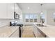 Bright kitchen with stainless steel appliances, granite countertops, and hardwood floors at 235 Hunters Ridge Dr, Danville, IN 46122