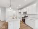 Stylish kitchen features stainless steel appliances and a central island with sink and seating at 235 Hunters Ridge Dr, Danville, IN 46122