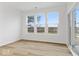 Bright living space with hardwood floors and large windows, perfect for entertaining at 235 Hunters Ridge Dr, Danville, IN 46122