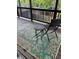 Relax on this balcony furnished with a chair and a small table on a patterned rug at 1213 Cottage Ave, Indianapolis, IN 46203