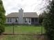 Fenced backyard featuring a well-maintained lawn, screened-in porch and mature trees for added privacy at 744 Helm Dr, Avon, IN 46123