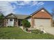 Charming single-Gathering home featuring a brick facade and a manicured front yard at 744 Helm Dr, Avon, IN 46123