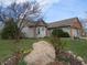 Charming home with a well-manicured lawn, colorful flower beds, and inviting curb appeal at 744 Helm Dr, Avon, IN 46123