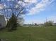 Scenic view of the community pond and green space on a sunny day at 744 Helm Dr, Avon, IN 46123