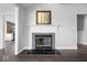 Spacious living room with fireplace and views into the kitchen at 7602 Garrick St, Fishers, IN 46038