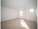 Bright bedroom featuring neutral carpet, window, and ample natural light at 7904 Magnolia St, New Palestine, IN 46163