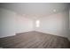 Bright, airy bedroom with recessed lighting, neutral walls, and wood-style flooring at 7904 Magnolia St, New Palestine, IN 46163