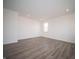 Bright bedroom featuring modern floors, neutral walls, and ample natural light at 7904 Magnolia St, New Palestine, IN 46163