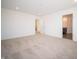 Bright bedroom featuring neutral carpet, recessed lighting, and access to the bathroom at 7904 Magnolia St, New Palestine, IN 46163