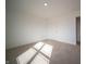 Cozy bedroom with neutral carpet, recessed lighting, and a white door, creating a clean and modern look at 7904 Magnolia St, New Palestine, IN 46163