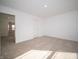Bedroom with neutral carpet and access to the bathroom at 7904 Magnolia St, New Palestine, IN 46163