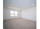Bright bedroom featuring carpet floors, neutral walls, and ample natural light at 7904 Magnolia St, New Palestine, IN 46163