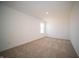 Bedroom featuring neutral carpet and a window at 7904 Magnolia St, New Palestine, IN 46163