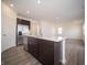 Open kitchen island that offers stainless steel appliances and eat in space for guests at 7904 Magnolia St, New Palestine, IN 46163