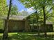 A lovely brick house boasts large windows and lush trees on a sunny day at 4257 Tattersall Dr, Plainfield, IN 46168