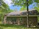 Brick house exterior featuring multiple windows, a skylight, and access stairs at 4257 Tattersall Dr, Plainfield, IN 46168