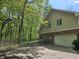 House exterior view showcasing a brick and vinyl facade with a two-car garage and basketball hoop at 4257 Tattersall Dr, Plainfield, IN 46168