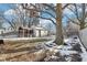 Backyard features shed, mature trees, and snow at 5441 E 17Th St, Indianapolis, IN 46218