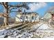Spacious backyard with mature tree and partial snow cover at 5441 E 17Th St, Indianapolis, IN 46218