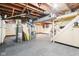 Unfinished basement with laundry hookups and ample storage space at 5441 E 17Th St, Indianapolis, IN 46218