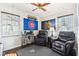 Relaxing bedroom with two leather chairs and hardwood floors at 5441 E 17Th St, Indianapolis, IN 46218