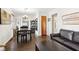 Bright dining area with dark wood table and leather sofa at 5441 E 17Th St, Indianapolis, IN 46218