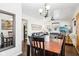 Dining area with wood table, chandelier, and mirror at 5441 E 17Th St, Indianapolis, IN 46218
