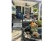 Inviting front porch with fall decorations, seating, and hanging plants, creating a welcoming atmosphere at 5441 E 17Th St, Indianapolis, IN 46218