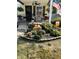 Inviting porch with furniture and fall decorations, surrounded by lush plants and seasonal accents at 5441 E 17Th St, Indianapolis, IN 46218