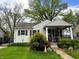 Charming single story home with well-maintained front yard and inviting covered porch at 5441 E 17Th St, Indianapolis, IN 46218