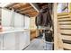 Basement laundry area with washer, dryer, and storage at 5441 E 17Th St, Indianapolis, IN 46218