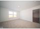 Well-lit bedroom with neutral carpet and exterior view at 1426 Bluebonnet Pl, Shelbyville, IN 46176