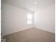 Spacious bedroom with neutral carpeting and large window at 1426 Bluebonnet Pl, Shelbyville, IN 46176