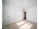 Spacious bedroom with neutral decor, carpet flooring, and a large window at 1426 Bluebonnet Pl, Shelbyville, IN 46176