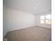 Spacious bedroom with neutral carpeting and large window at 1426 Bluebonnet Pl, Shelbyville, IN 46176