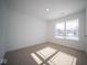 Well-lit bedroom with neutral-colored walls and carpeted floors at 1426 Bluebonnet Pl, Shelbyville, IN 46176