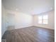 Spacious bonus room with wood-look floors and access to bedroom at 1426 Bluebonnet Pl, Shelbyville, IN 46176