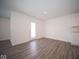 Bright dining area with wood-look flooring and access to patio at 1426 Bluebonnet Pl, Shelbyville, IN 46176