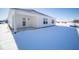 Newly constructed home features a covered patio and snow-covered backyard at 1426 Bluebonnet Pl, Shelbyville, IN 46176
