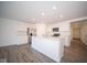 Modern kitchen with island and stainless steel appliances at 1426 Bluebonnet Pl, Shelbyville, IN 46176
